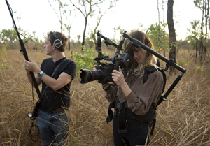 Camera and sound film crew shot from behind the scenes
